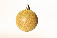 A bauble decorating a Christmas tree