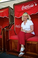 Blonde girl sitting on bench