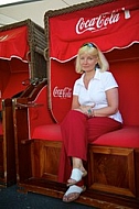 Blonde girl sitting on bench