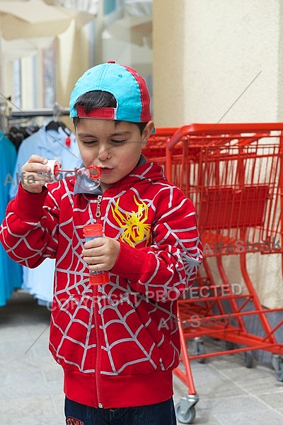 Boy with red spiderman sweater