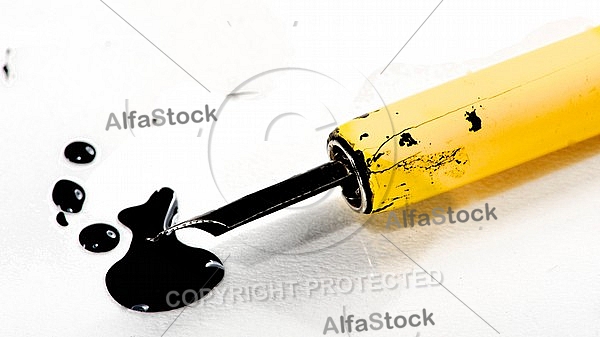 Fountain pen with black ink drops