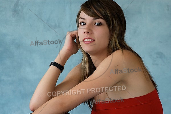 Girl in red top and brown skirt with brown hair