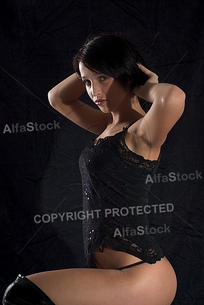 Girl shooting, black background