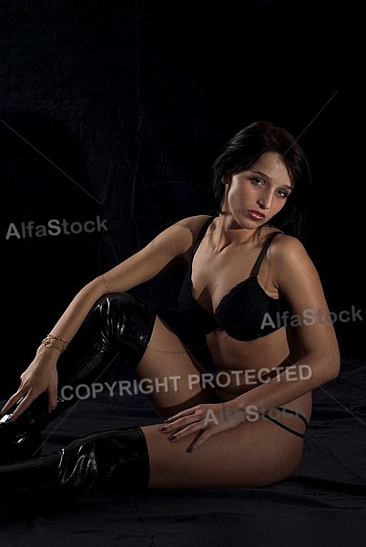 Girl shooting, black background
