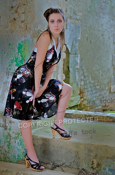 Girl with black dress in an old building