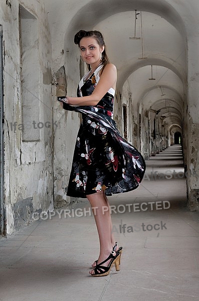 Girl with black dress in an old building