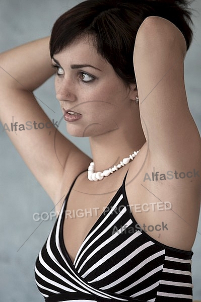 Girl with black hair in black and white clothes