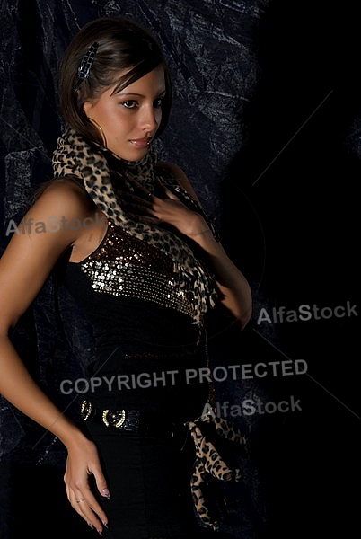 Girl with brown hair and leopard patterned clothes