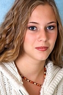 Girl with brown hair and white sleeves