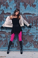 Girl with brown hair, pink tights and black dress