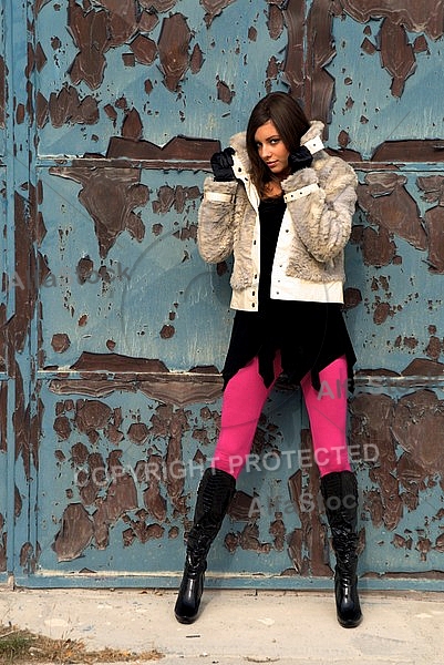 Girl with brown hair, pink tights and black dress