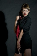 Modell girl posing with red umbrella