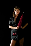 Modell girl posing with red umbrella