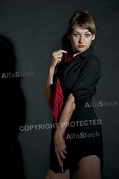 Modell girl posing with red umbrella