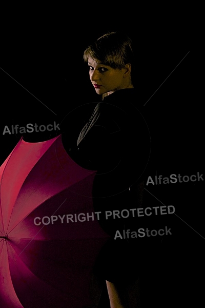 Modell girl posing with red umbrella