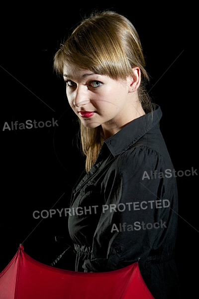 Modell girl posing with red umbrella