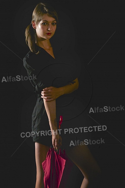 Modell girl posing with red umbrella