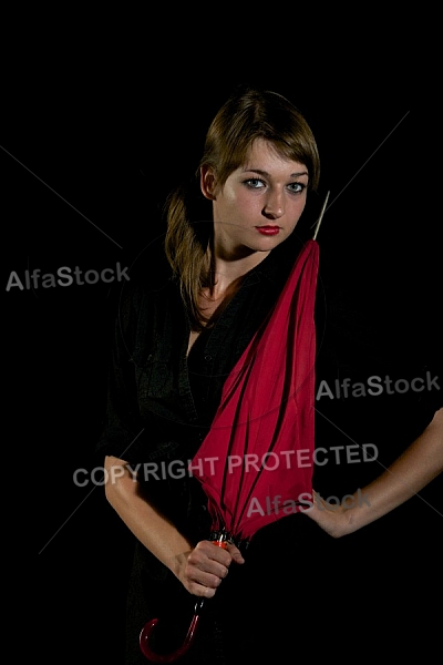 Modell girl posing with red umbrella