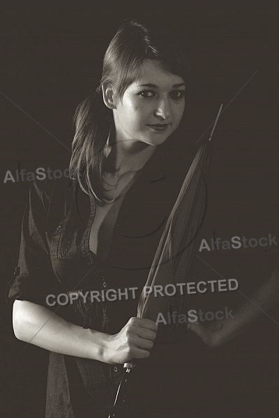 Modell girl posing with red umbrella