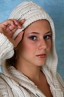 Portrait of a girl with brown hair and white sleeves