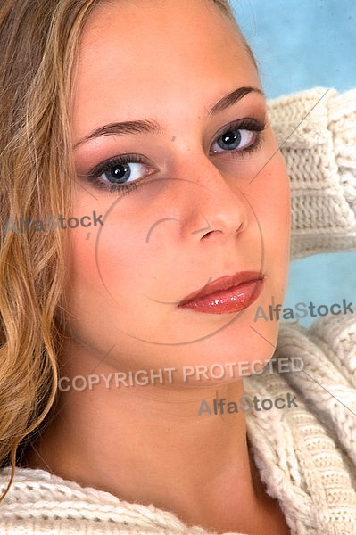 Portrait of a girl with brown hair and white sleeves