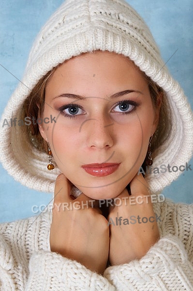 Portrait of a girl with brown hair and white sleeves