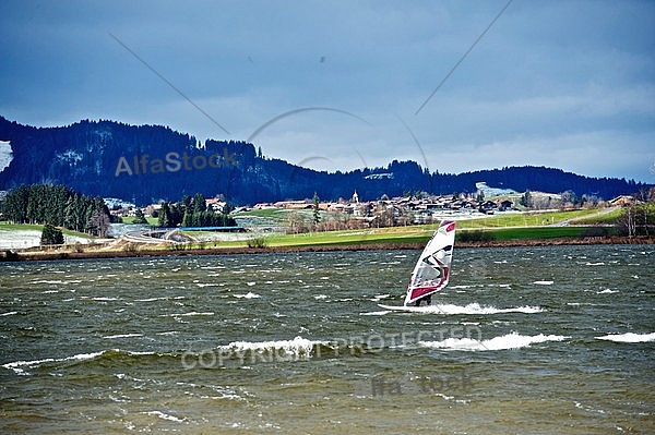 Surfer in the strom, Hopfensee, Bavaria, Germany