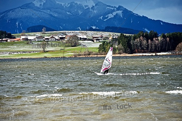 Surfer in the strom, Hopfensee, Bavaria, Germany