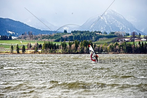 Surfer in the strom, Hopfensee, Bavaria, Germany