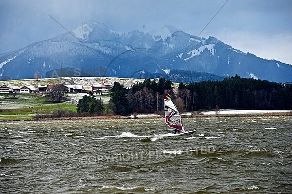 Surfer in the strom, Hopfensee, Bavaria, Germany