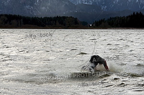 Surfer in the strom, Hopfensee, Bavaria, Germany