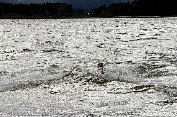 Surfer in the strom, Hopfensee, Bavaria, Germany