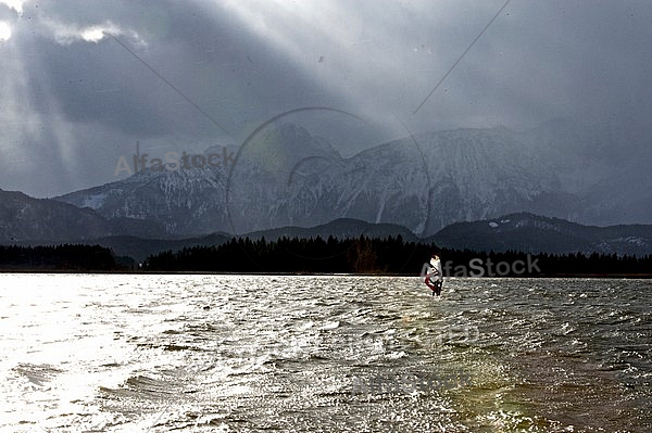 Surfer in the strom, Hopfensee, Bavaria, Germany