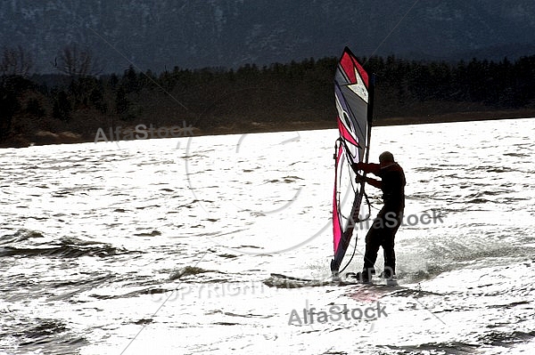 Surfer in the strom, Hopfensee, Bavaria, Germany