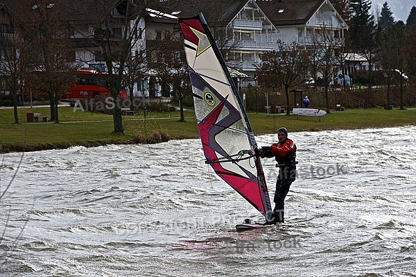 Surfer in the strom, Hopfensee, Bavaria, Germany