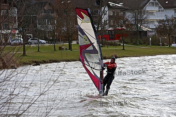 Surfer in the strom, Hopfensee, Bavaria, Germany