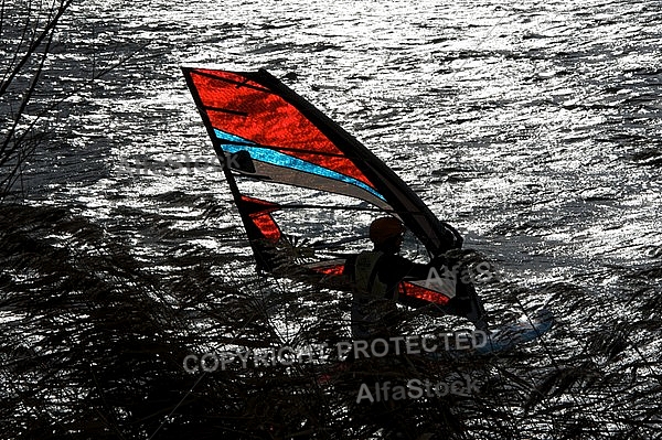 Surfer in the strom, Hopfensee, Bavaria, Germany