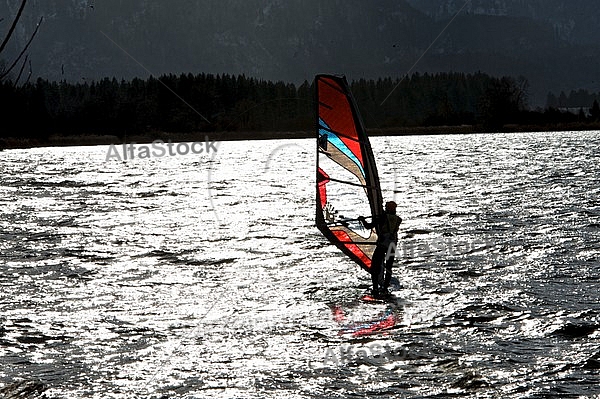 Surfer in the strom, Hopfensee, Bavaria, Germany