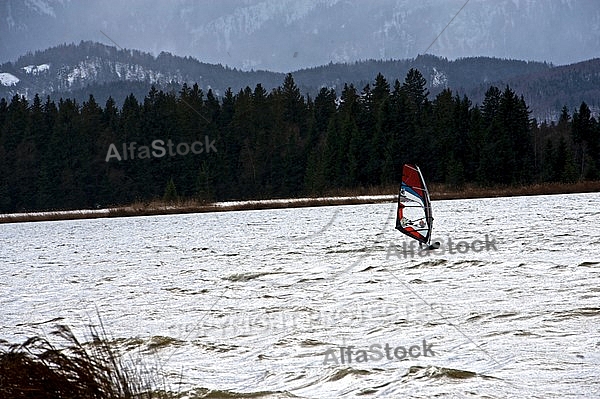 Surfer in the strom, Hopfensee, Bavaria, Germany