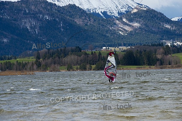 Surfer in the strom, Hopfensee, Bavaria, Germany