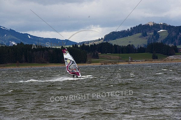 Surfer in the strom, Hopfensee, Bavaria, Germany