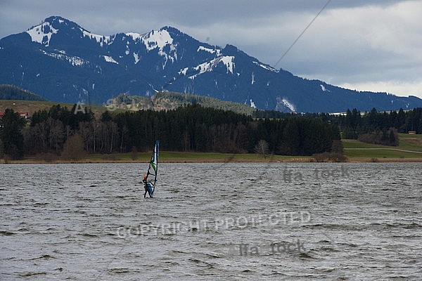 Surfer in the strom, Hopfensee, Bavaria, Germany