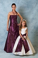 Woman and girl in purple and white Dresses