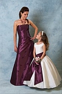 Woman and girl in purple and white Dresses