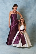 Woman and girl in purple and white Dresses