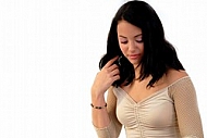 Young girl packs her bags for traveling. White background