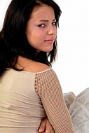 Young girl packs her bags for traveling. White background