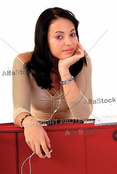 Young girl packs her bags for traveling. White background