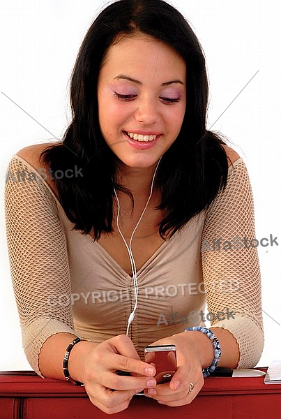 Young girl packs her bags for traveling. White background