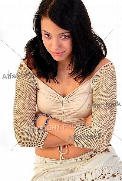 Young girl packs her bags for traveling. White background